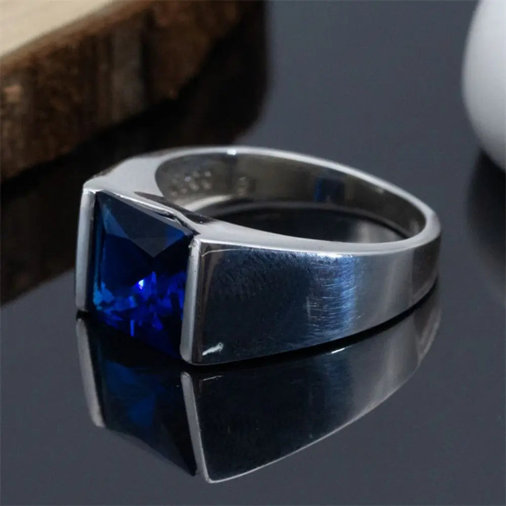 ANEL EM PRATA ESTERLINA 925 COM PEDRA AZUL NATURAL ZIRCÃO