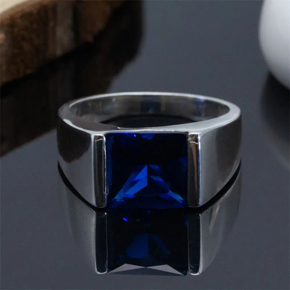 ANEL EM PRATA ESTERLINA 925 COM PEDRA AZUL NATURAL ZIRCÃO